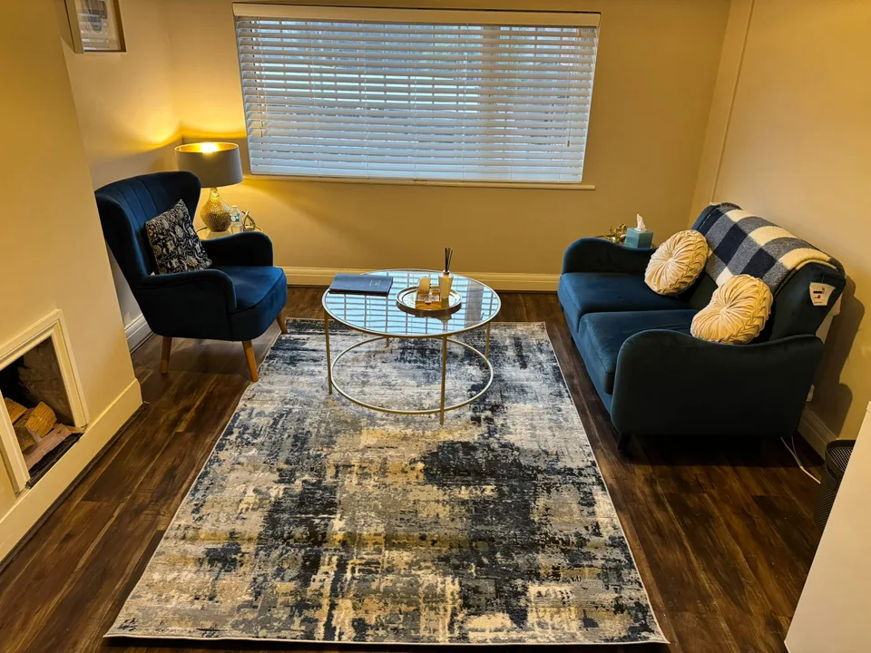 Gemma's therapy room in Solihull — comfortable seating in a warm, calming space